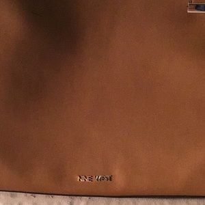 Brown nine W. tote big metal compartment and